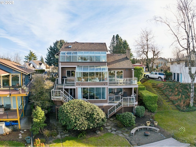 rear view of property featuring stairway