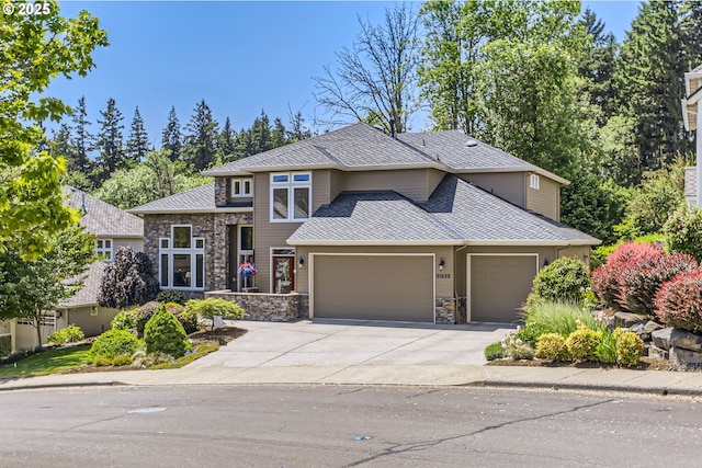 31235 SW Willamette Way, Wilsonville, OR 97070 - view of front facade with a garage, stone siding, concrete driveway, and roof with shingles