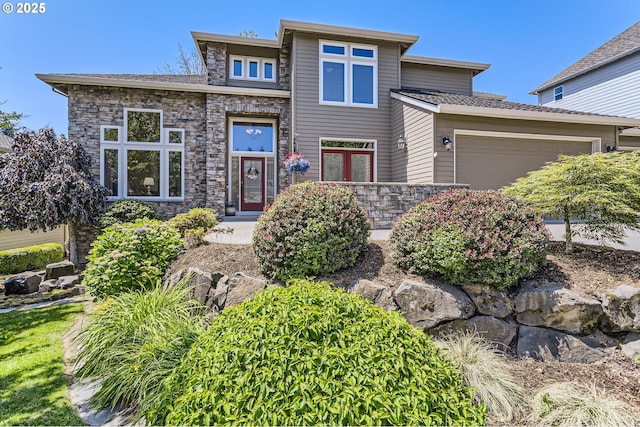 31235 SW Willamette Way, Wilsonville, OR 97070 - view of front of house with an attached garage and stone siding