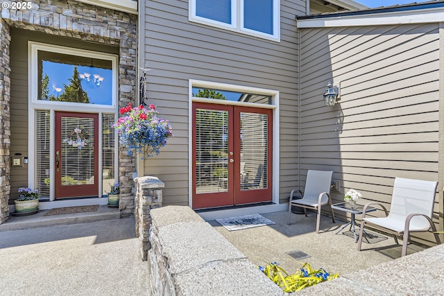 31235 SW Willamette Way, Wilsonville, OR 97070 - doorway to property with stone siding and french doors