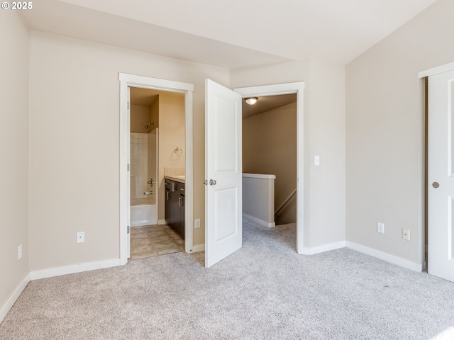 10442 SW Akilean Ter, Portland, OR 97223 - unfurnished bedroom with light colored carpet, baseboards, and connected bathroom