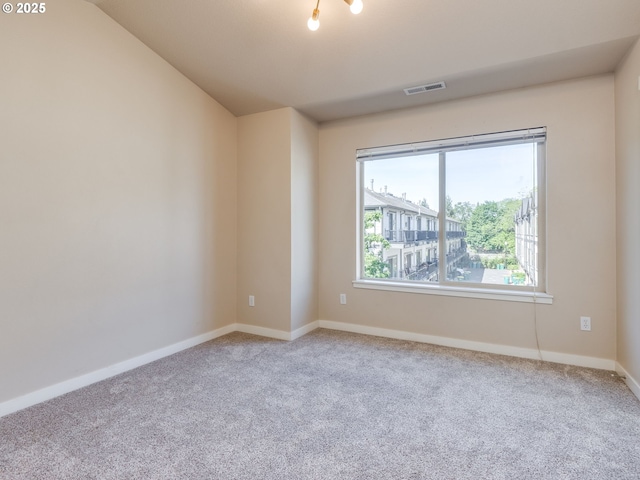 10442 SW Akilean Ter, Portland, OR 97223 - empty room with carpet flooring, baseboards, and lofted ceiling