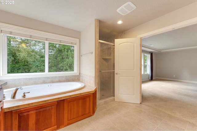 bathroom with separate shower and tub