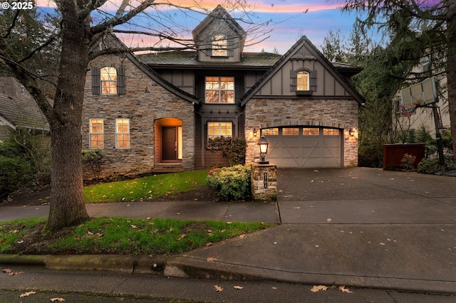 tudor house featuring a garage