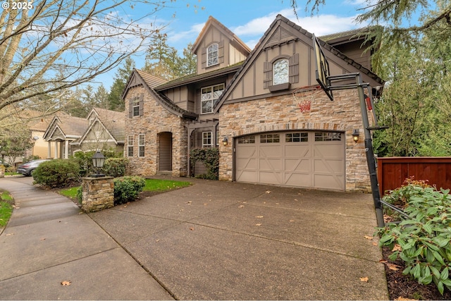 tudor-style house featuring a garage