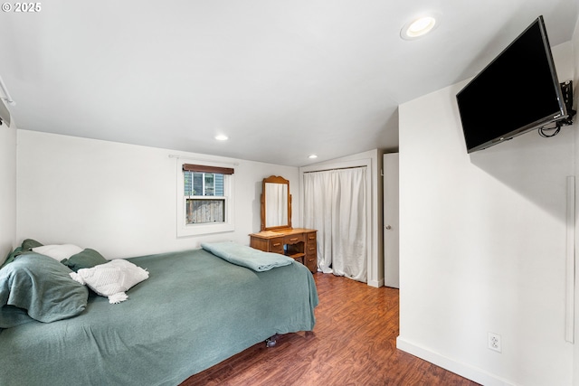 bedroom featuring recessed lighting and wood finished floors