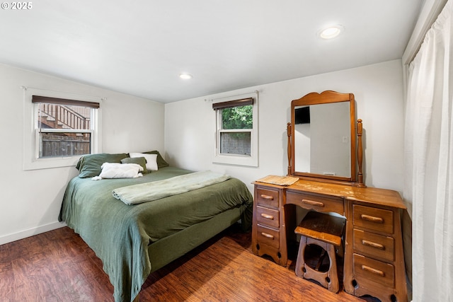 bedroom featuring dark wood-type flooring, recessed lighting, and baseboards