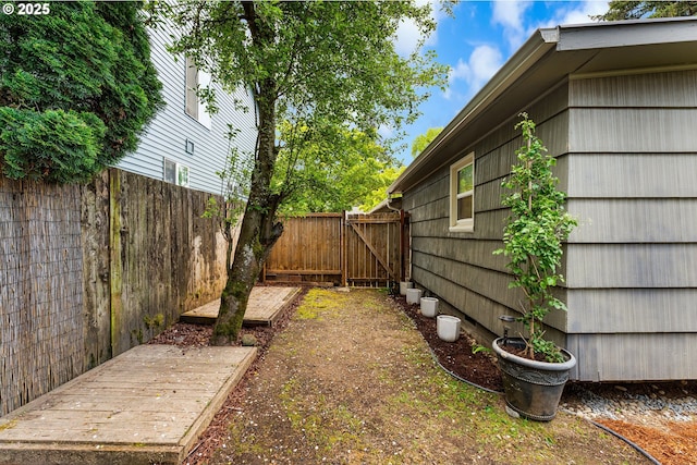 view of yard featuring a gate and fence