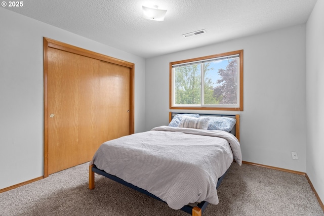 15302 NE 88th St, Vancouver, WA 98682 - bedroom with carpet flooring, a closet, and a textured ceiling
