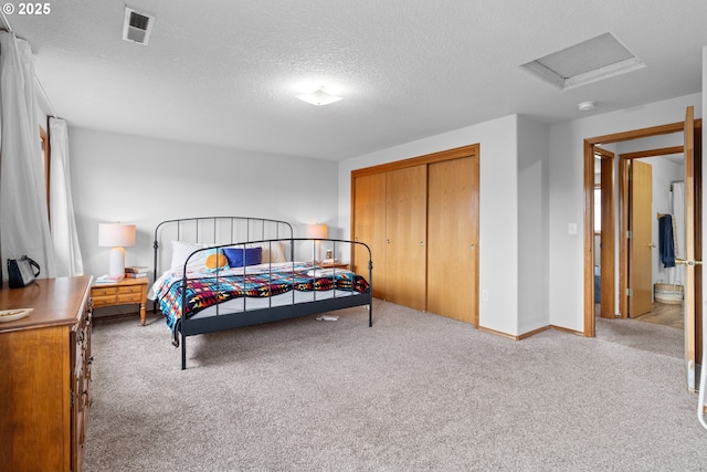 15302 NE 88th St, Vancouver, WA 98682 - bedroom featuring attic access, carpet, a textured ceiling, and a closet