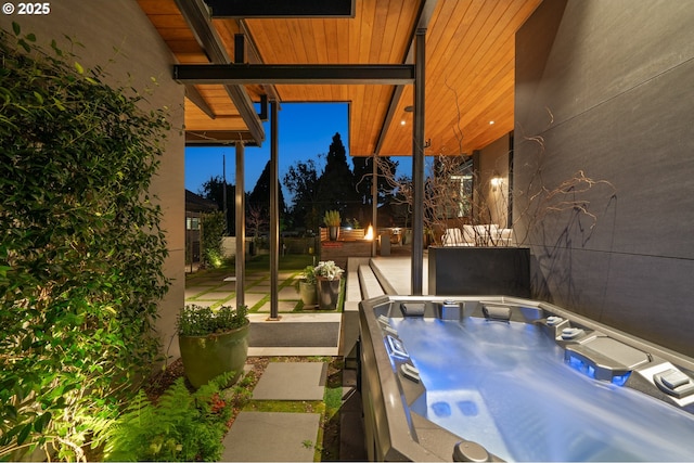 view of patio with a hot tub