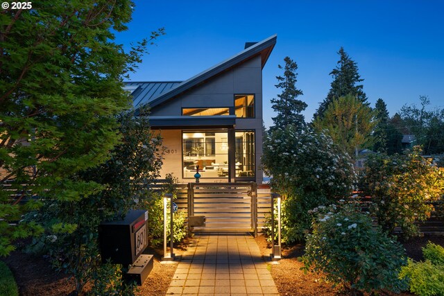 view of front of house with a standing seam roof and metal roof