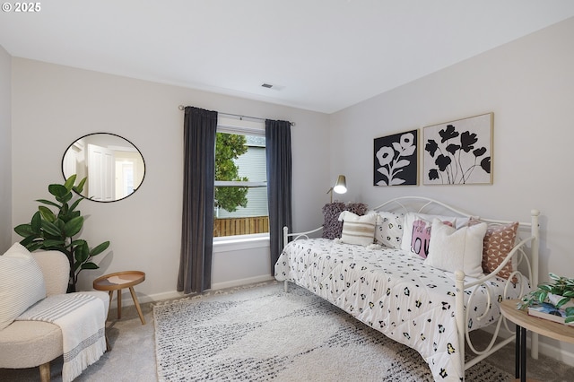 bedroom with carpet, visible vents, and baseboards