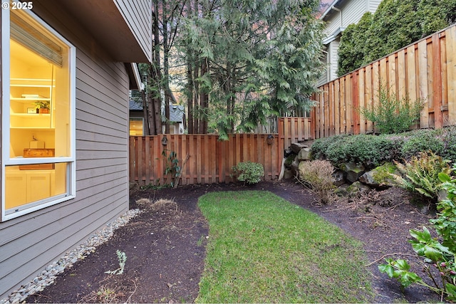 view of yard with a fenced backyard