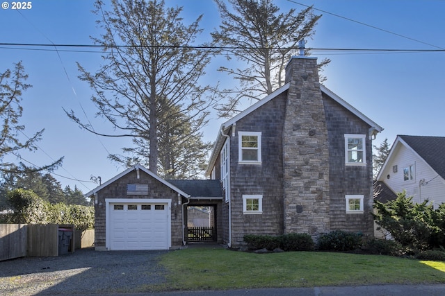 view of front facade featuring a garage and a front lawn