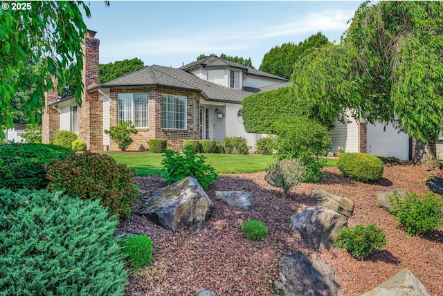 12717 SE Bluff Dr, Clackamas, OR 97015 - view of front of home with brick siding, a chimney, and a front yard