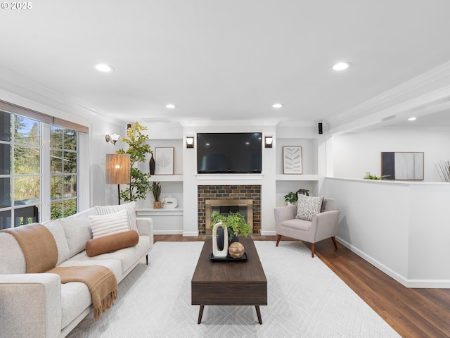 8920 SW 9th Dr, Portland, OR 97219 - living room with ornamental molding, wood finished floors, recessed lighting, a fireplace, and baseboards