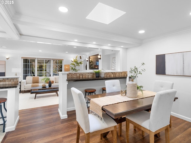 8920 SW 9th Dr, Portland, OR 97219 - dining space with ornamental molding, a skylight, dark wood-style flooring, and recessed lighting