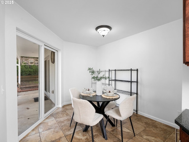8920 SW 9th Dr, Portland, OR 97219 - dining space featuring baseboards and light stone finish flooring