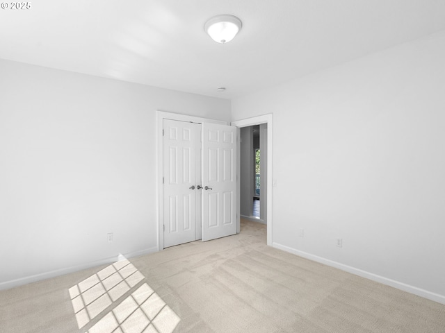 8920 SW 9th Dr, Portland, OR 97219 - unfurnished bedroom featuring light colored carpet, baseboards, and a closet