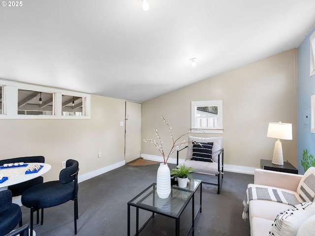 8920 SW 9th Dr, Portland, OR 97219 - living room featuring finished concrete floors, baseboards, and lofted ceiling