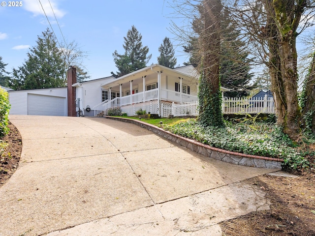 8920 SW 9th Dr, Portland, OR 97219 - view of front of house with a porch, driveway, fence, and an attached garage