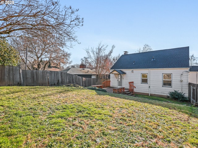 rear view of house with a lawn