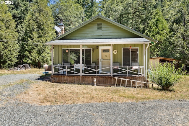 7291 Rice Valley Rd, Oakland, OR 97462 - view of front of house with a porch and a chimney