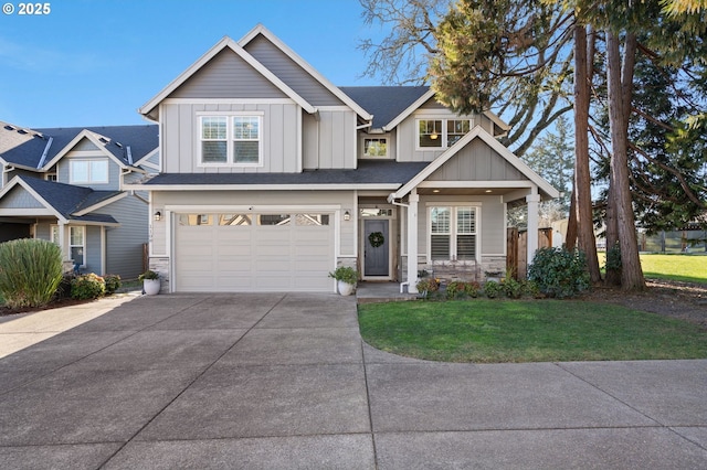 craftsman-style home featuring a garage and a front yard