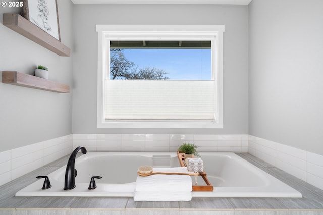 bathroom with a tub to relax in