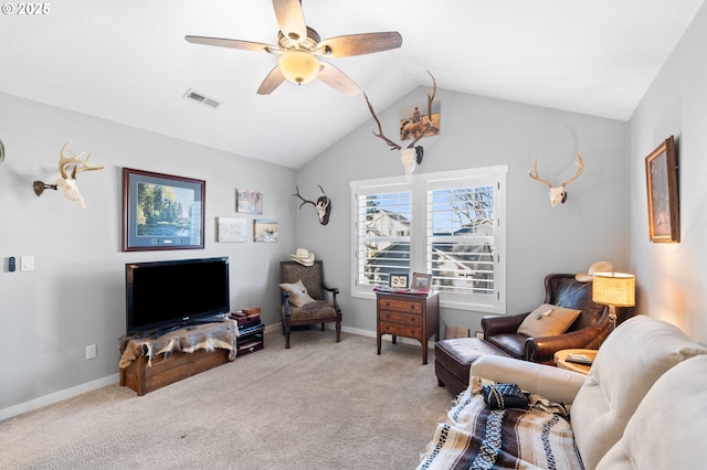 living room with carpet floors, vaulted ceiling, and ceiling fan