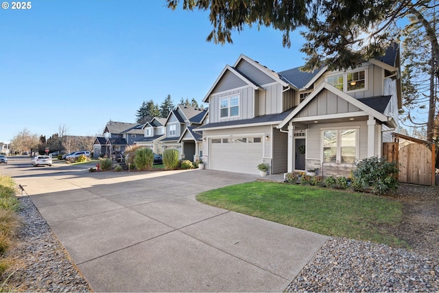 craftsman-style house featuring a garage and a front yard