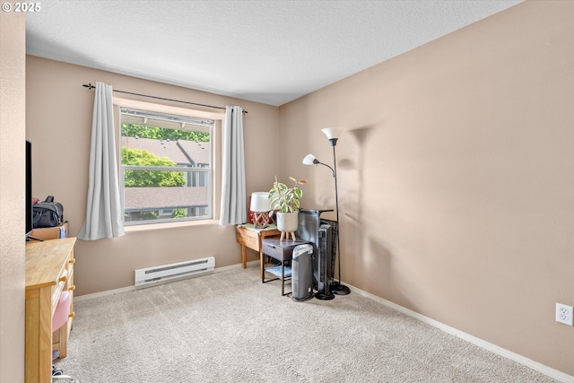 4728 W Powell Blvd Unit 231, Gresham, OR 97030 - carpeted office featuring a baseboard radiator, baseboards, and a textured ceiling