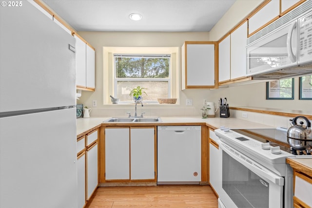 4728 W Powell Blvd Unit 231, Gresham, OR 97030 - kitchen with white appliances, a sink, light countertops, healthy amount of natural light, and recessed lighting
