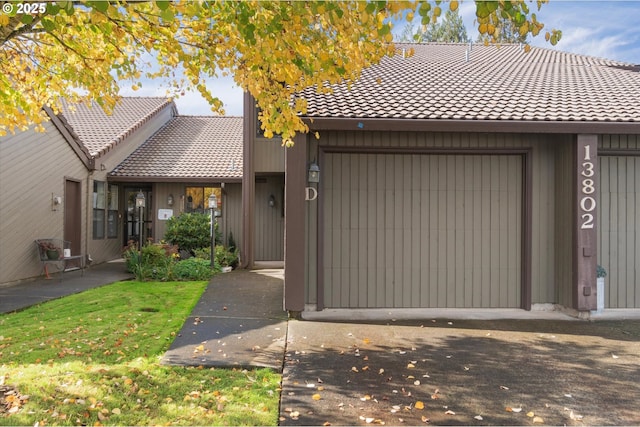 13802 NW 10th Ct, Vancouver, WA 98685 - view of front of property with a front lawn, a garage, and a tile roof