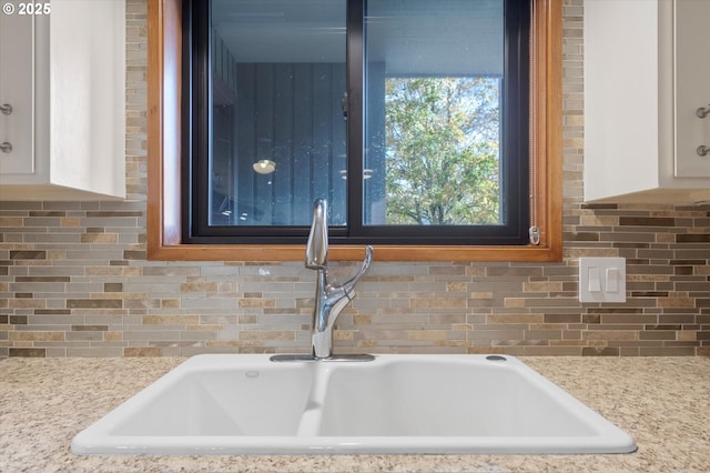 13802 NW 10th Ct, Vancouver, WA 98685 - details featuring white cabinetry, a sink, and decorative backsplash