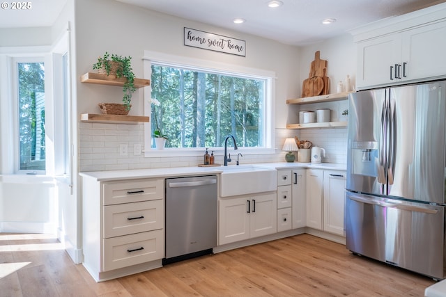 8751 SW 194th Pl, Beaverton, OR 97007 - kitchen featuring stainless steel appliances, open shelves, recessed lighting, white cabinetry, and light countertops