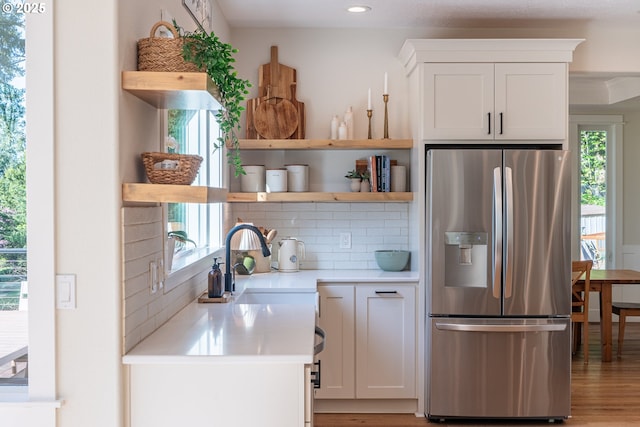 8751 SW 194th Pl, Beaverton, OR 97007 - kitchen featuring stainless steel refrigerator with ice dispenser, open shelves, backsplash, healthy amount of natural light, and recessed lighting