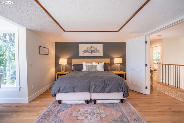 8751 SW 194th Pl, Beaverton, OR 97007 - bedroom with light wood finished floors and a textured ceiling