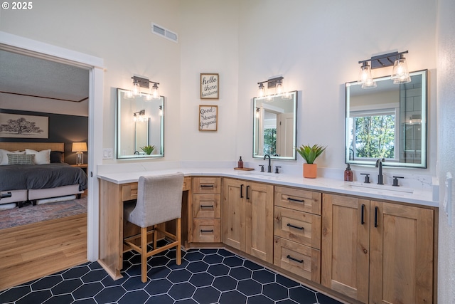8751 SW 194th Pl, Beaverton, OR 97007 - full bath with ensuite bath, double vanity, tile patterned flooring, and a high ceiling