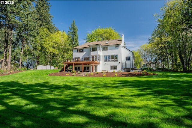 8751 SW 194th Pl, Beaverton, OR 97007 - back of house with stairway, a deck, a chimney, and a yard