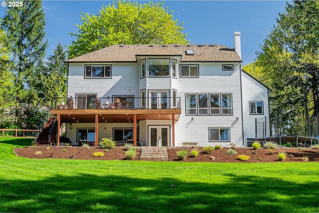 8751 SW 194th Pl, Beaverton, OR 97007 - rear view of property featuring french doors, a wooden deck, stairway, a chimney, and a yard