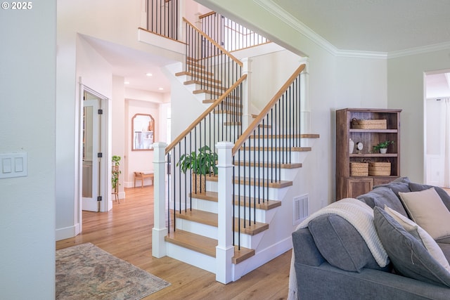 8751 SW 194th Pl, Beaverton, OR 97007 - stairway with wood finished floors and crown molding