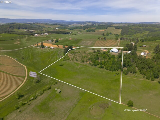 view of rural area with property boundaries highlighted and a mountain backdrop