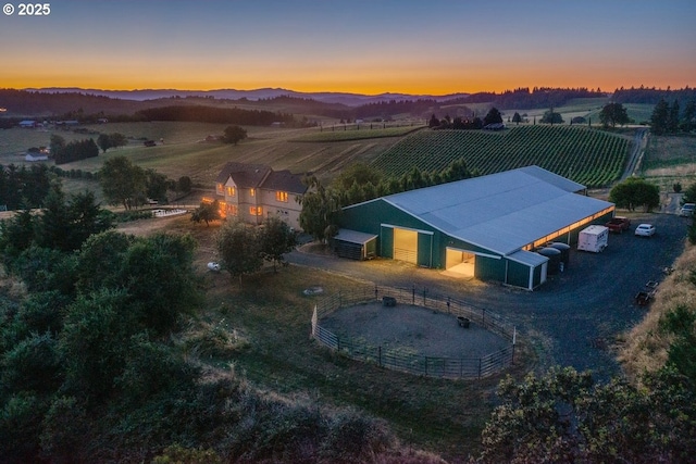aerial view at dusk of a rural view and a mountain view