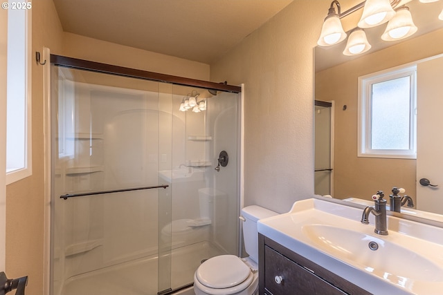 3026 NW Norwood St, Camas, WA 98607 - bathroom with toilet, a stall shower, vanity, and a textured wall