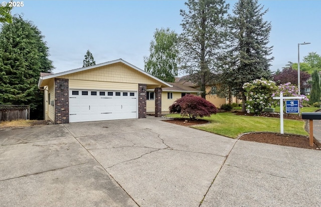 3026 NW Norwood St, Camas, WA 98607 - ranch-style house with driveway, a front yard, a garage, and brick siding