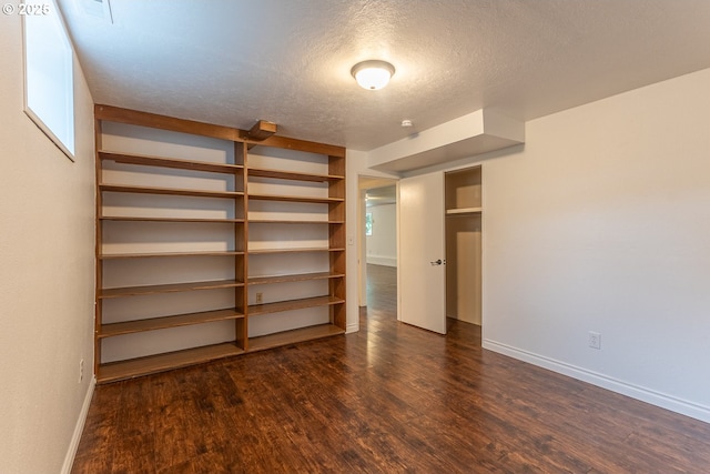 3026 NW Norwood St, Camas, WA 98607 - unfurnished bedroom featuring wood finished floors, baseboards, and a textured ceiling