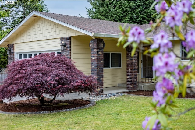 3026 NW Norwood St, Camas, WA 98607 - view of front facade with a front lawn, a shingled roof, and brick siding