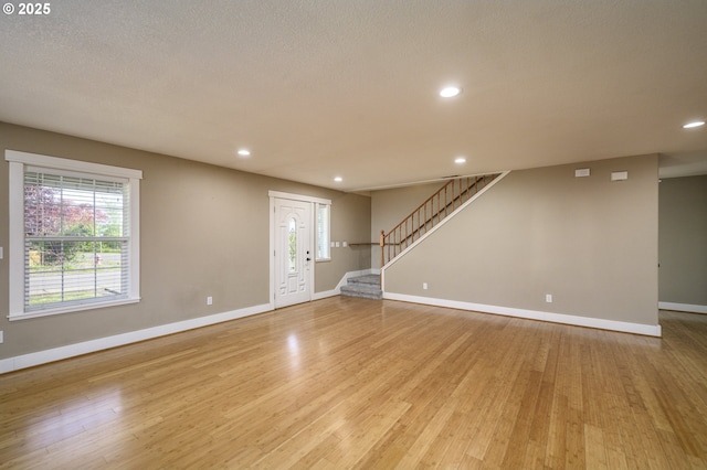 50 W Taylor St, Carlton, OR 97111 - unfurnished living room featuring baseboards, light wood finished floors, stairway, and recessed lighting